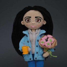 Crochet doll with flowers